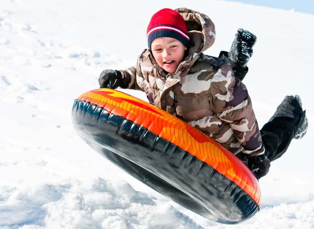 Snow Tube - Experience the thrill of snow tubing and sliding down snowy slopes