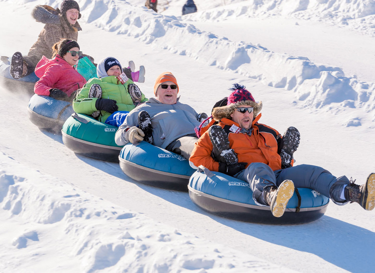 Snow Tube - Experience the thrill of snow tubing and sliding down snowy slopes