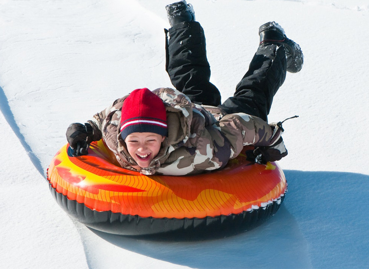 Snow Tube - Experience the thrill of snow tubing and sliding down snowy slopes